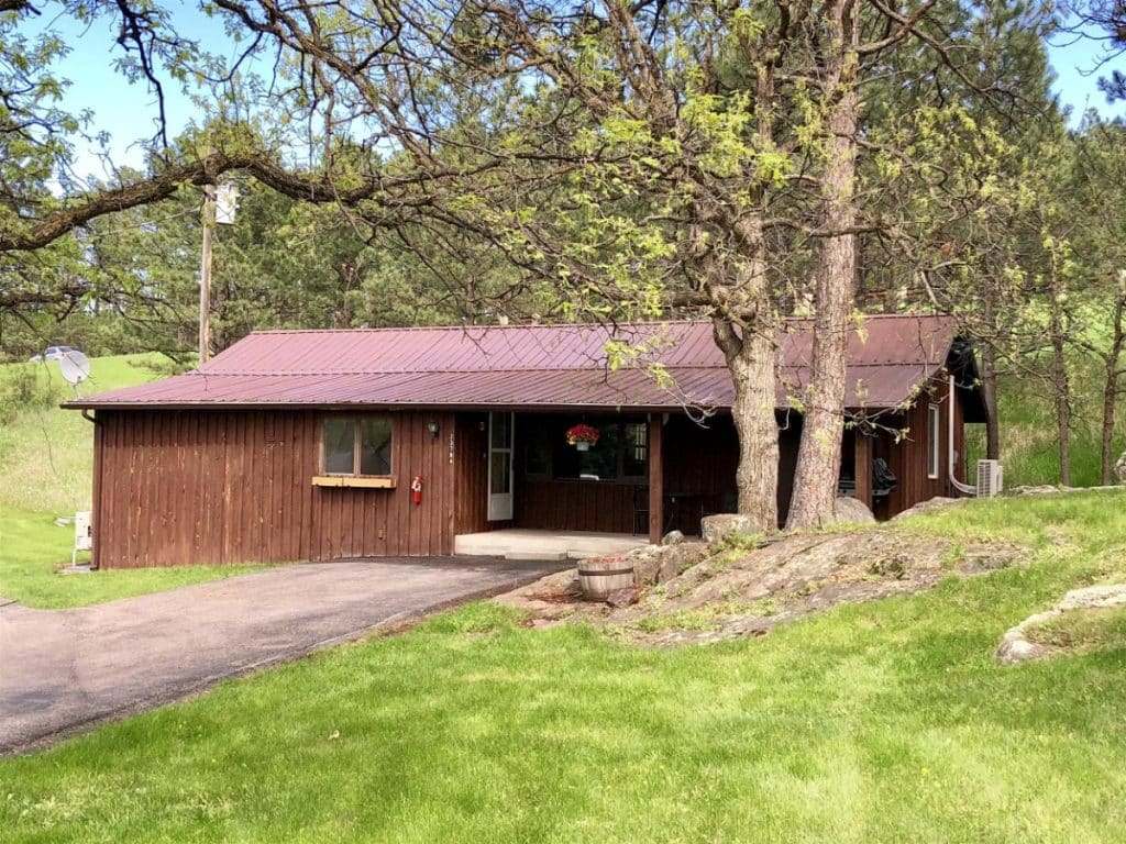 brown cabin behind tree