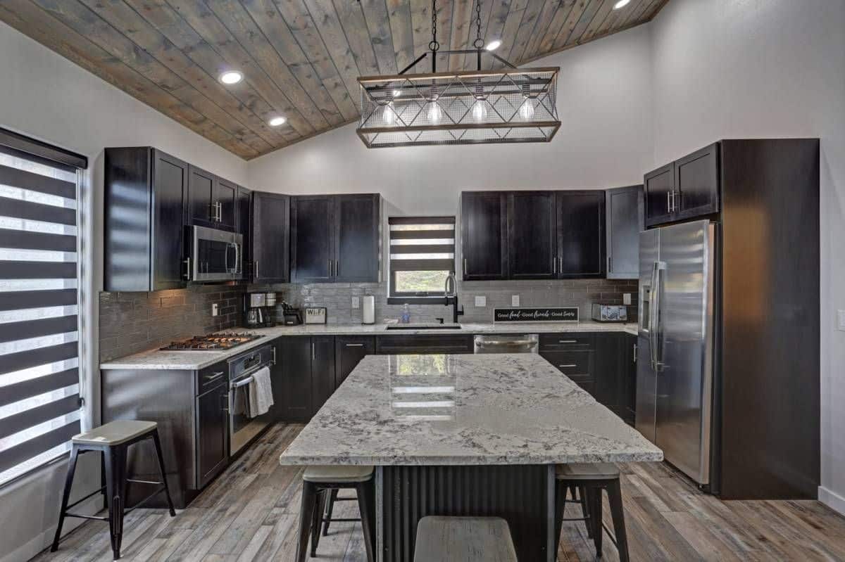 view across light gray island in center of kitchen