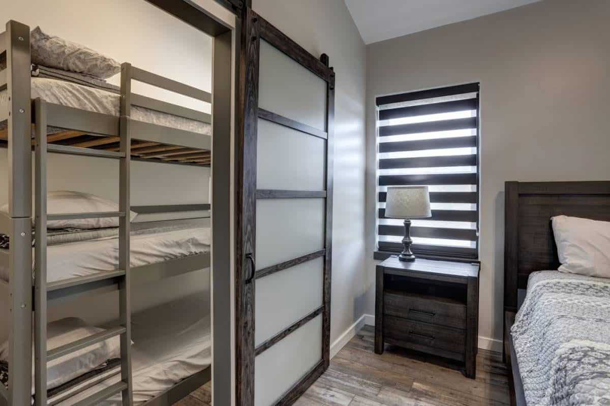 sliding door open showing bunk beds inside closet