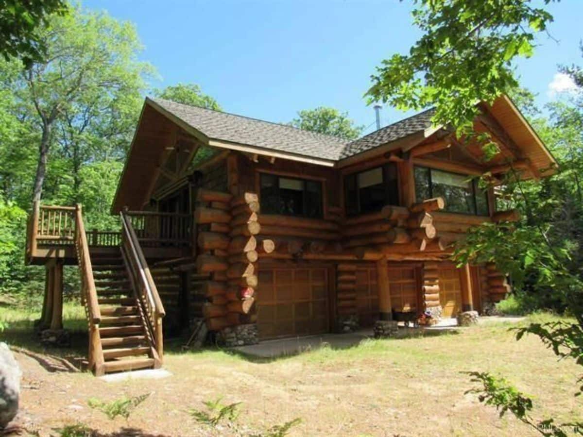 stairs leading to top floor of cabin on back side