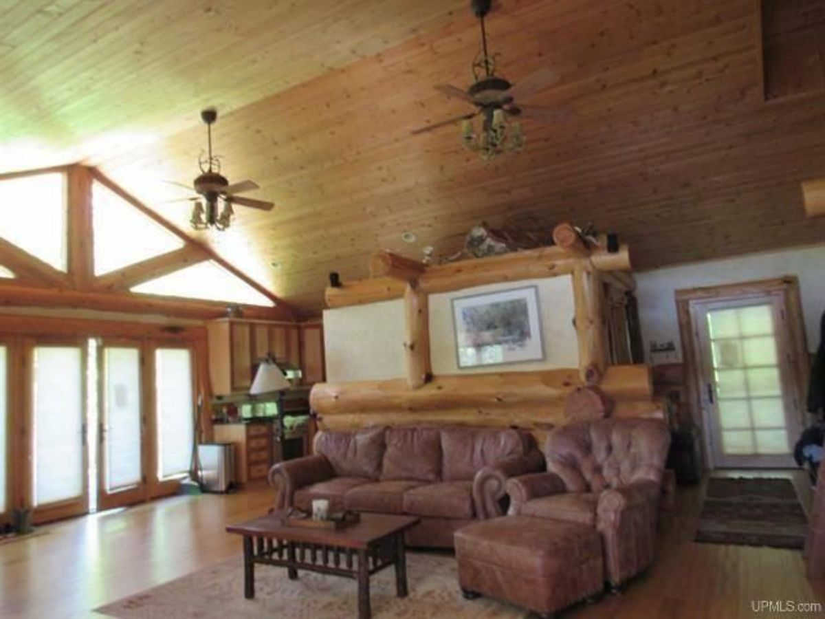 pink couch against wall inside cabin