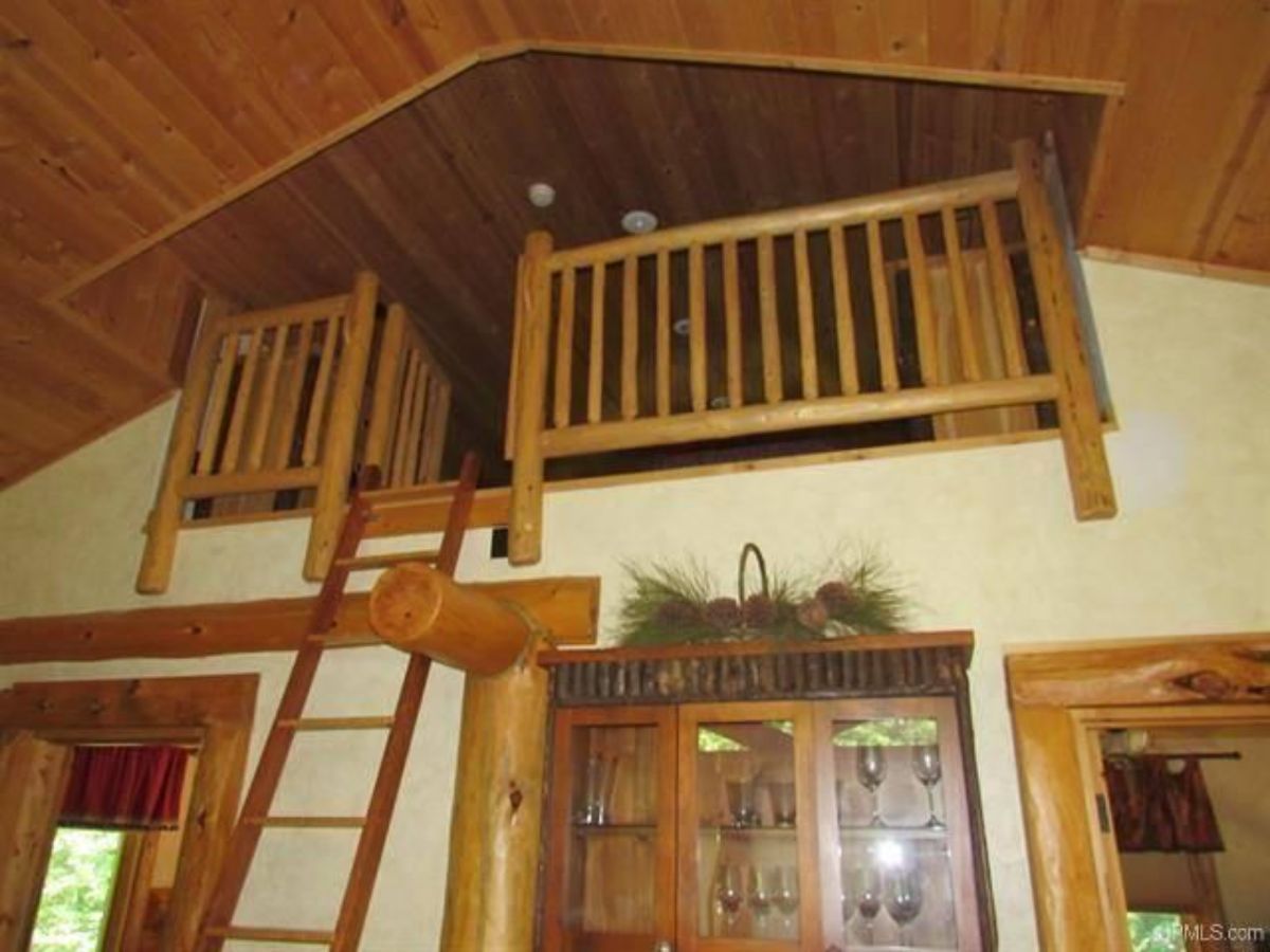 view from living room to loft in cabin