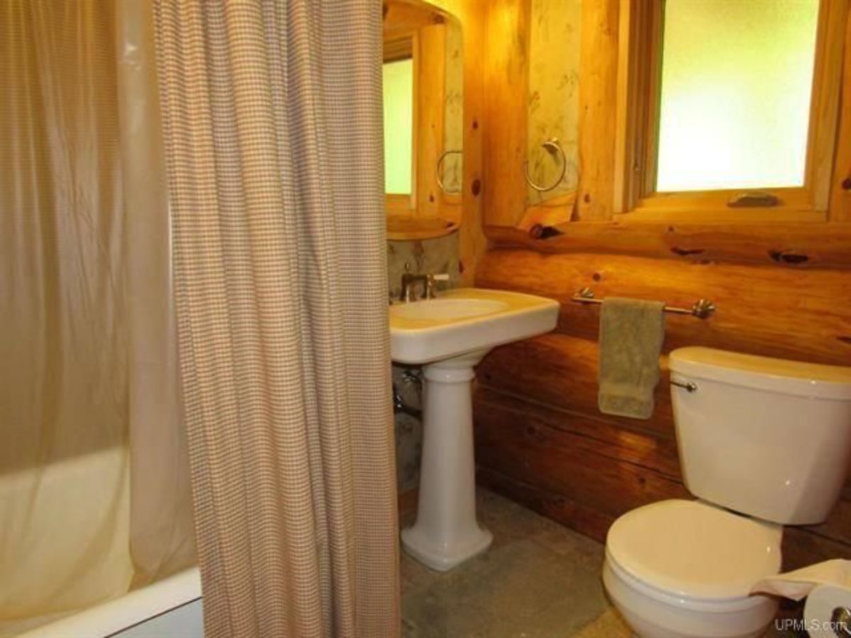 pedestal sink in cabin bathroom