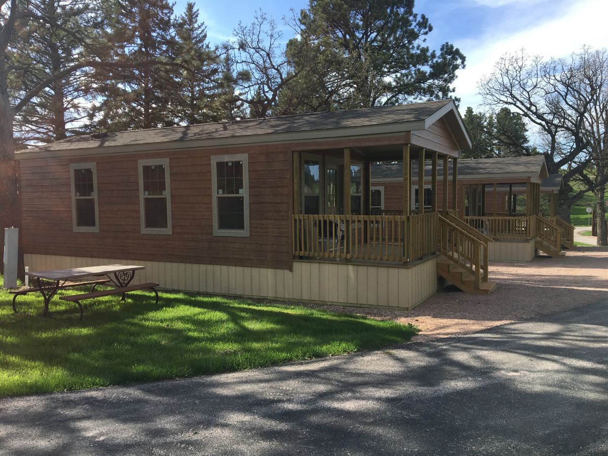 tiny house cabin with small porch on front