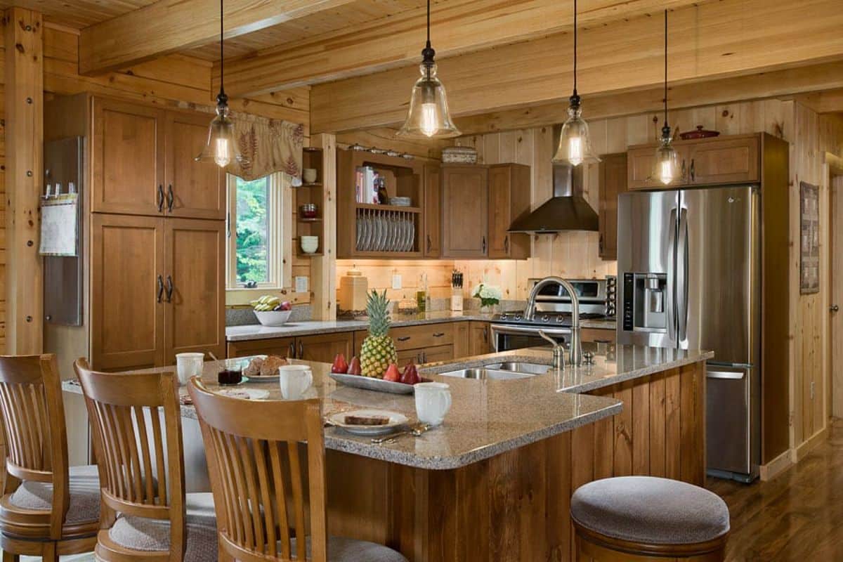 high backed stools by island bar in kitchen