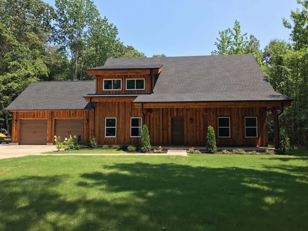 back side of cabin with wide door on right