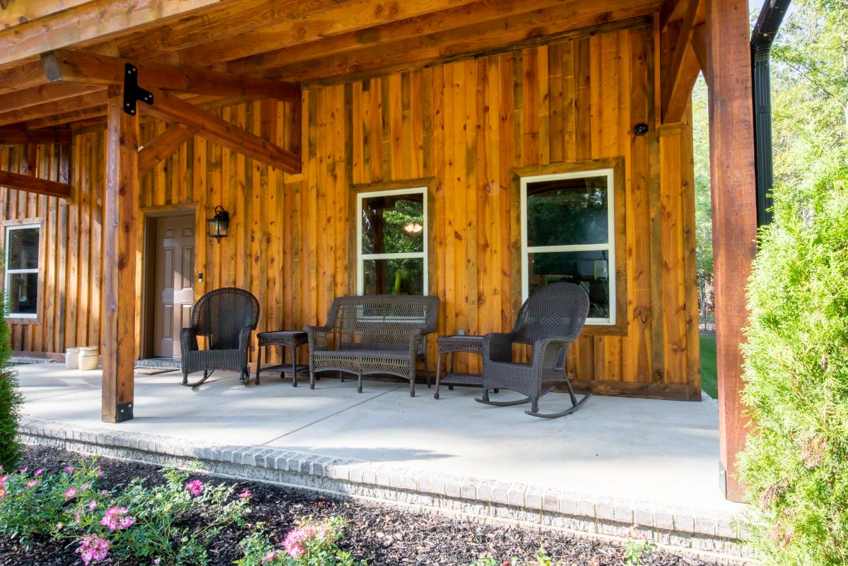 rocking chairs on front porch of log cabin