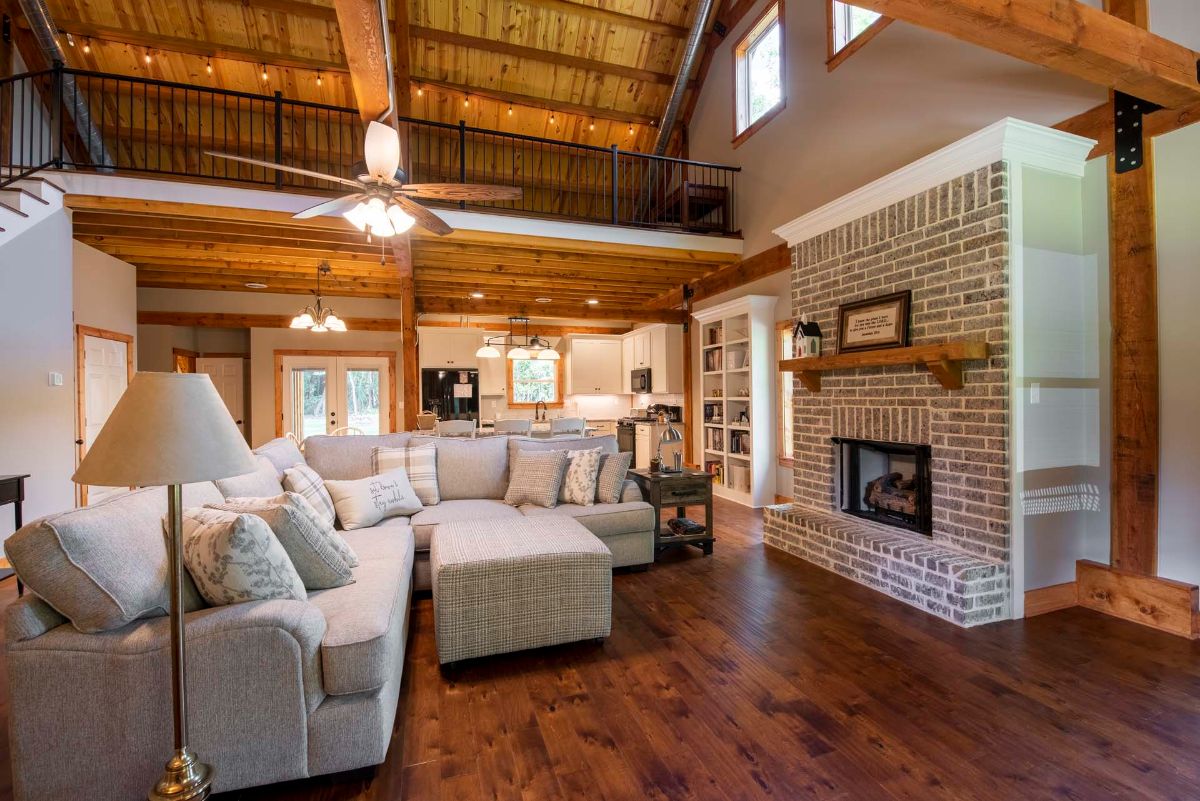 view across living room back to kitchen in log cabin