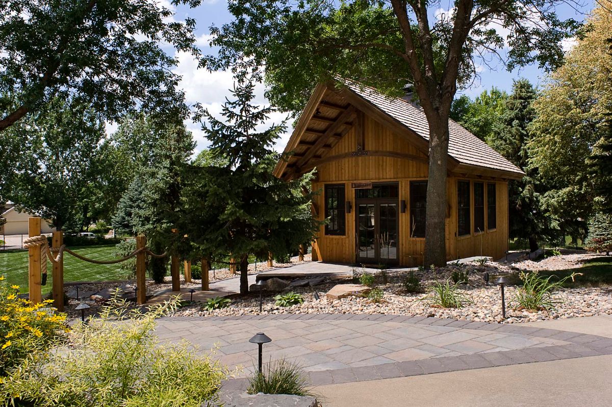 front of small cabin with gravel drive