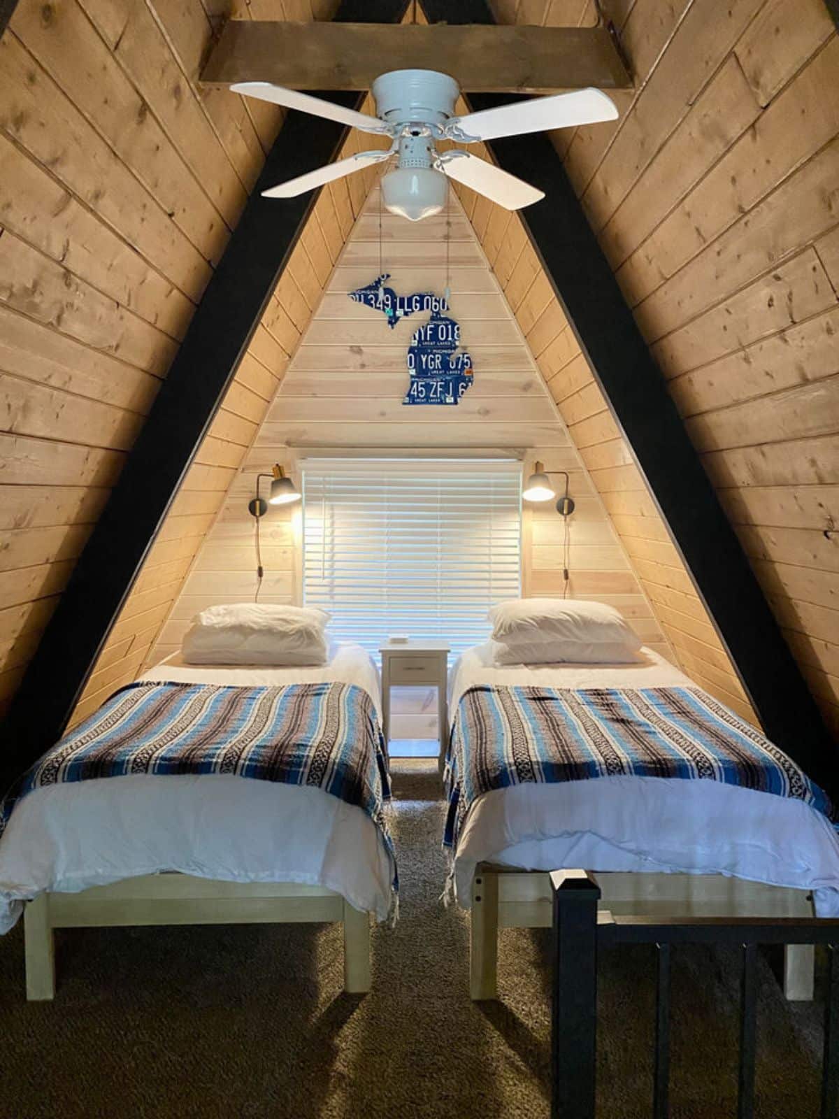 two twin beds uner loft of a-frame