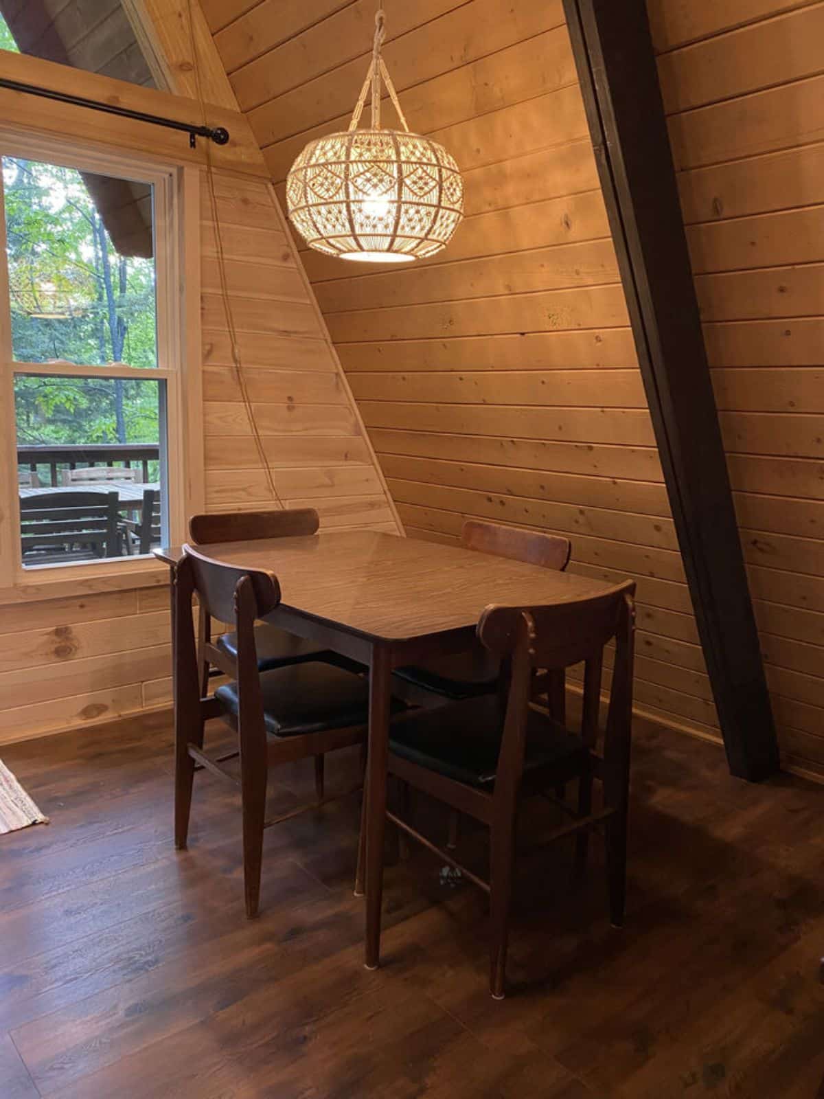 dining table under round lighting fixture