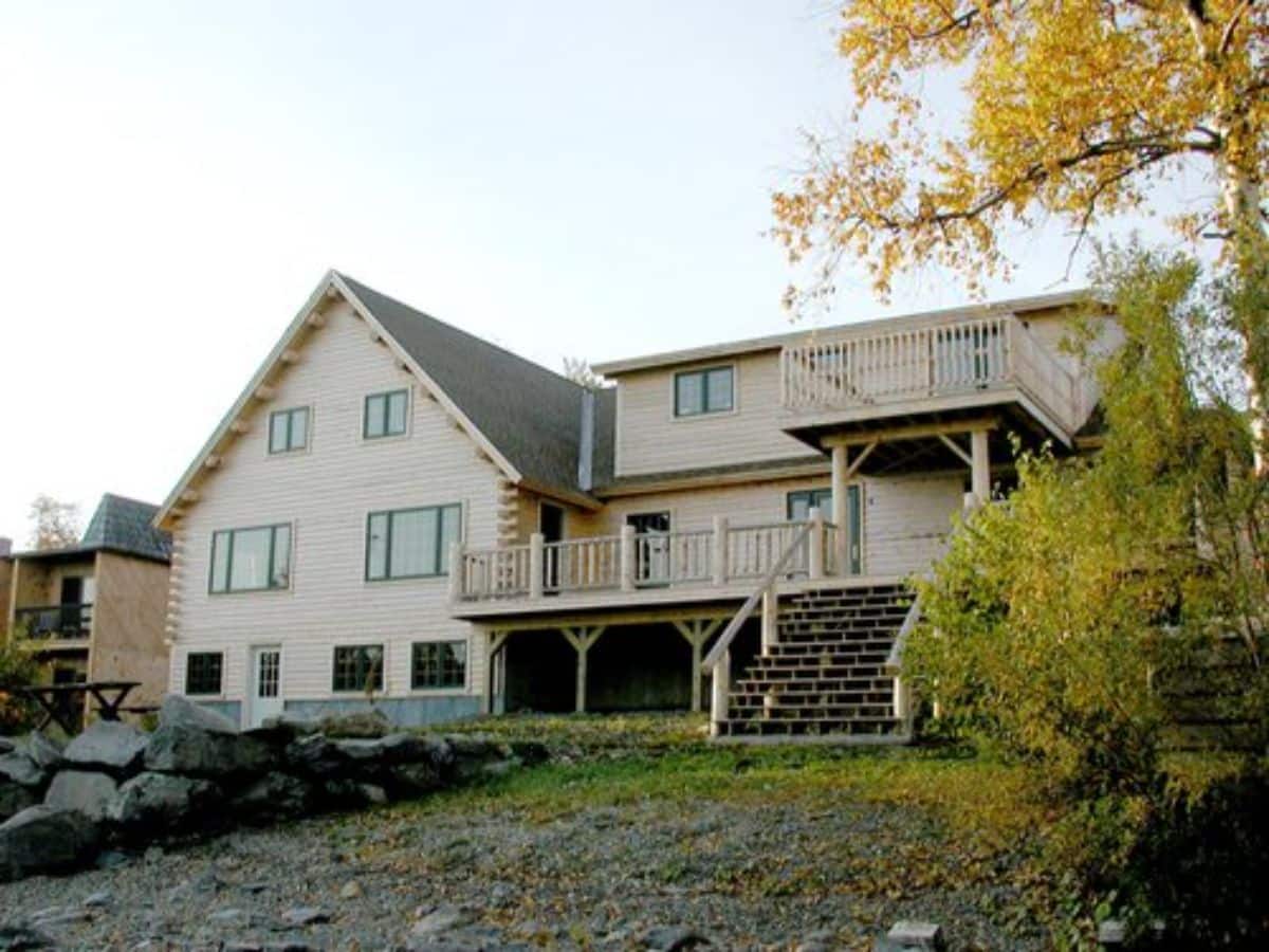 back side of cabin showing open deck and covered patio