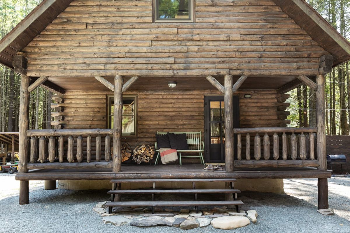 small covered front porch on log cabin