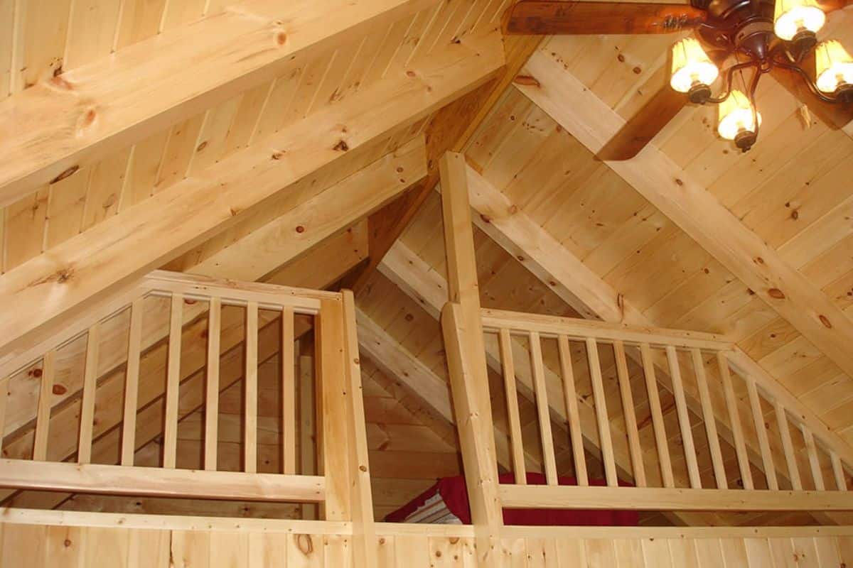 view of loft opening with wood railing