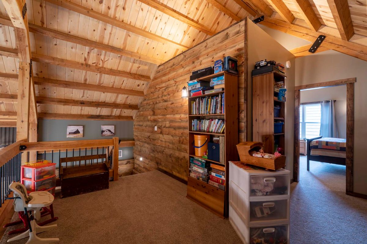 loft open space with bookshelf against right wall