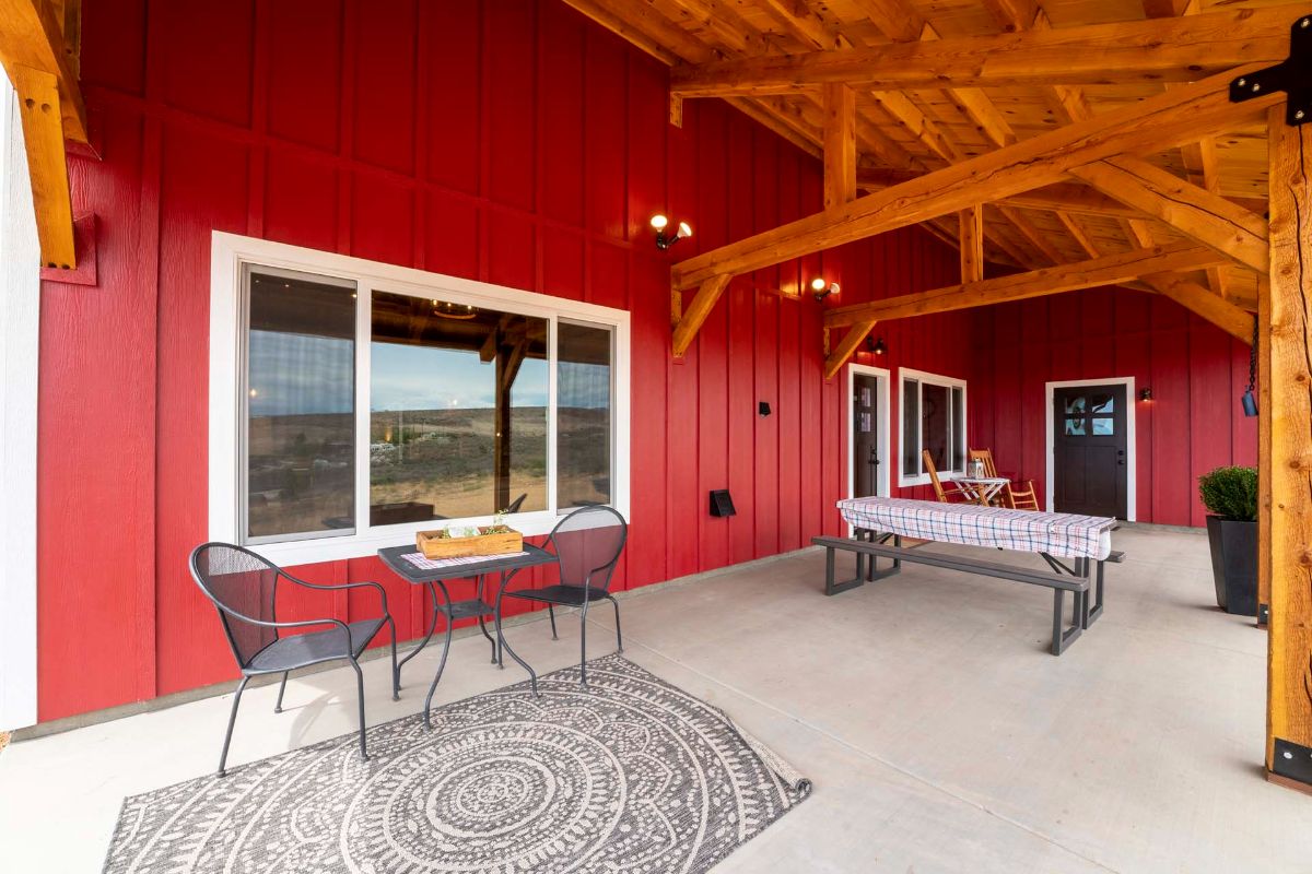 metal bistro set on porch of barn home