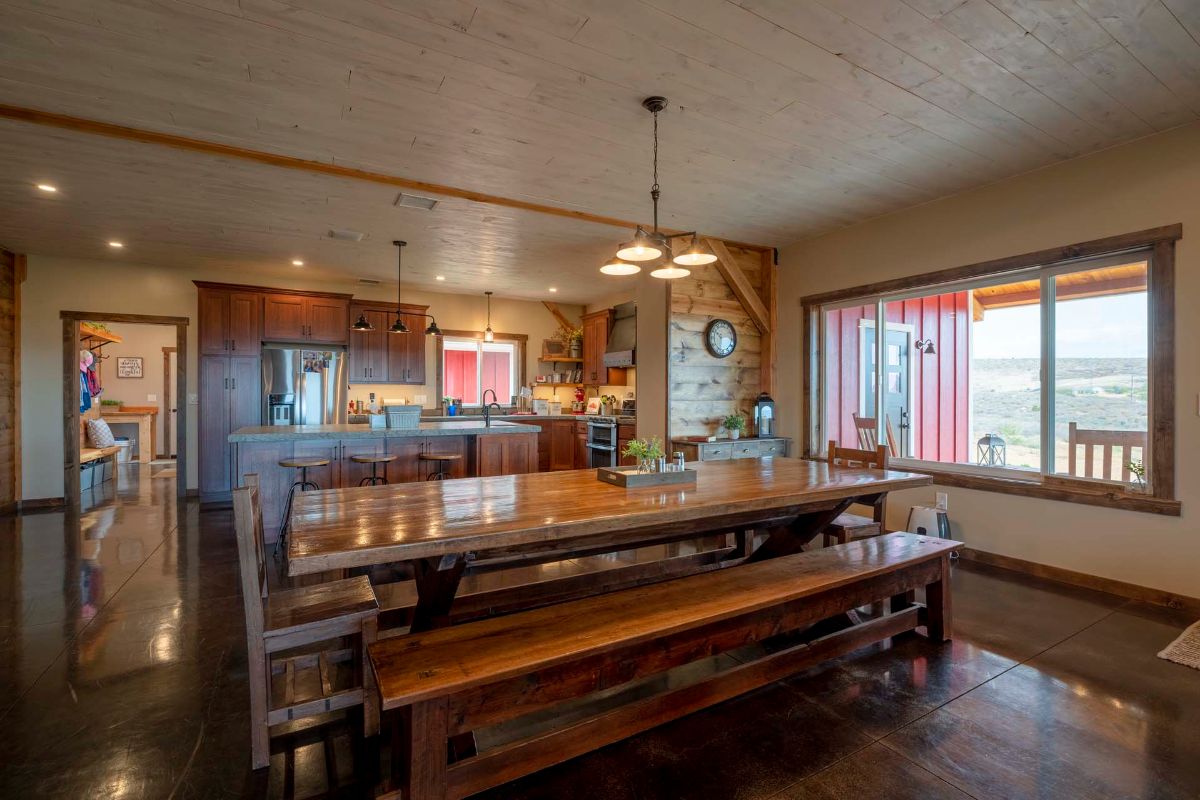 kitchen behind picnic table dining room space