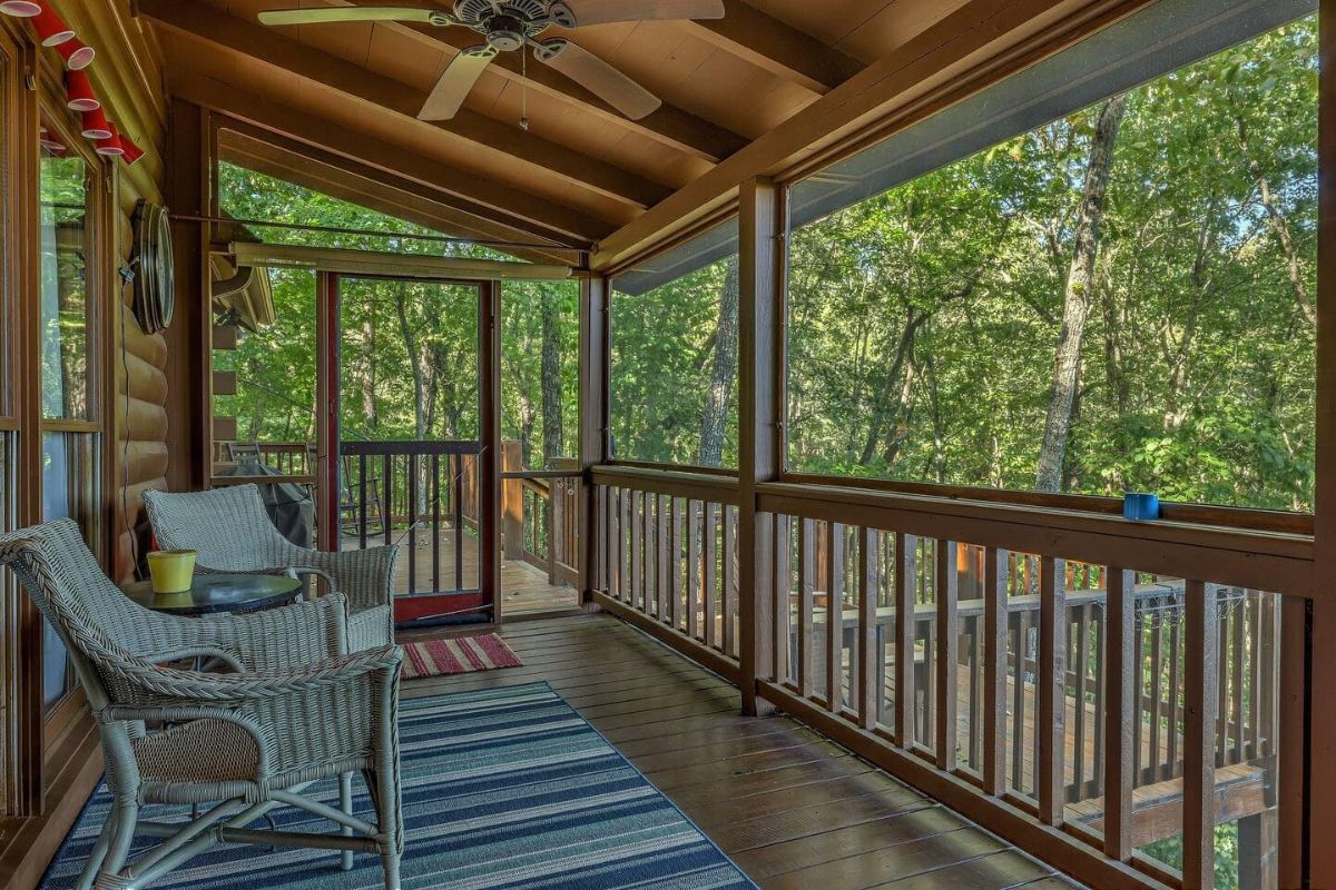 chairs against cabin in covered porch