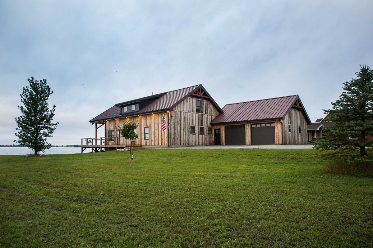 cabin with attached two car garage on water