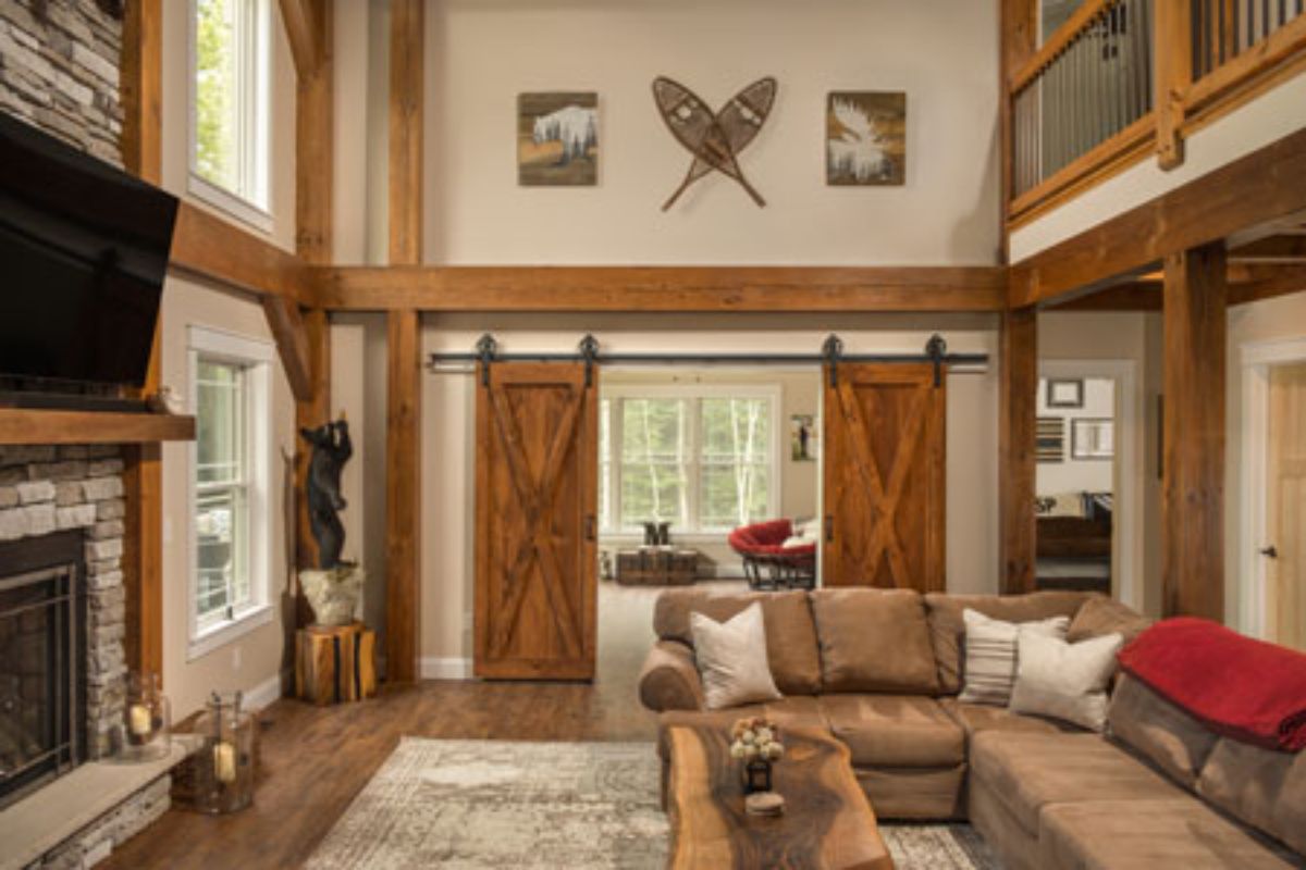 barn doors on both sides of window seat in living room