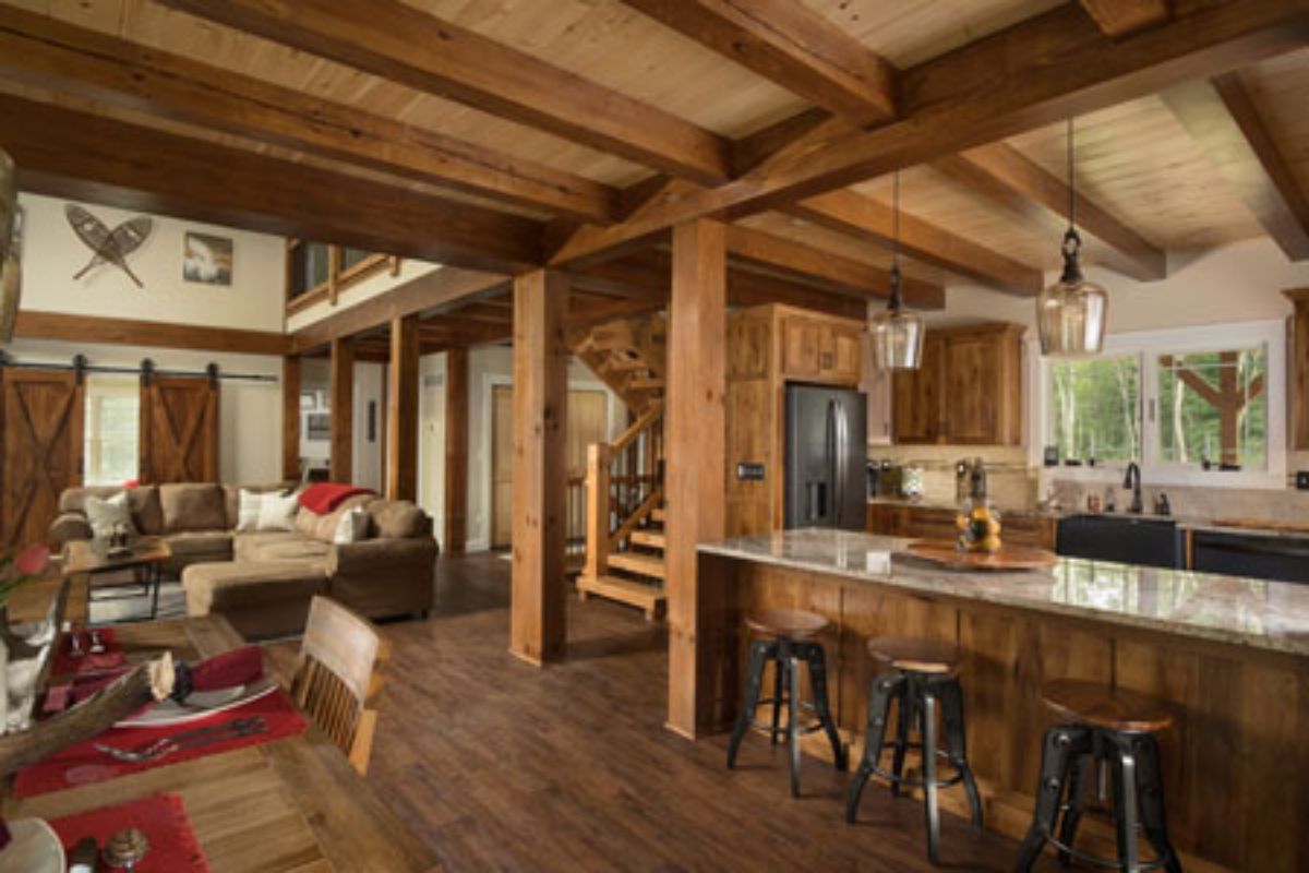 bar in living room with kitchen in the background