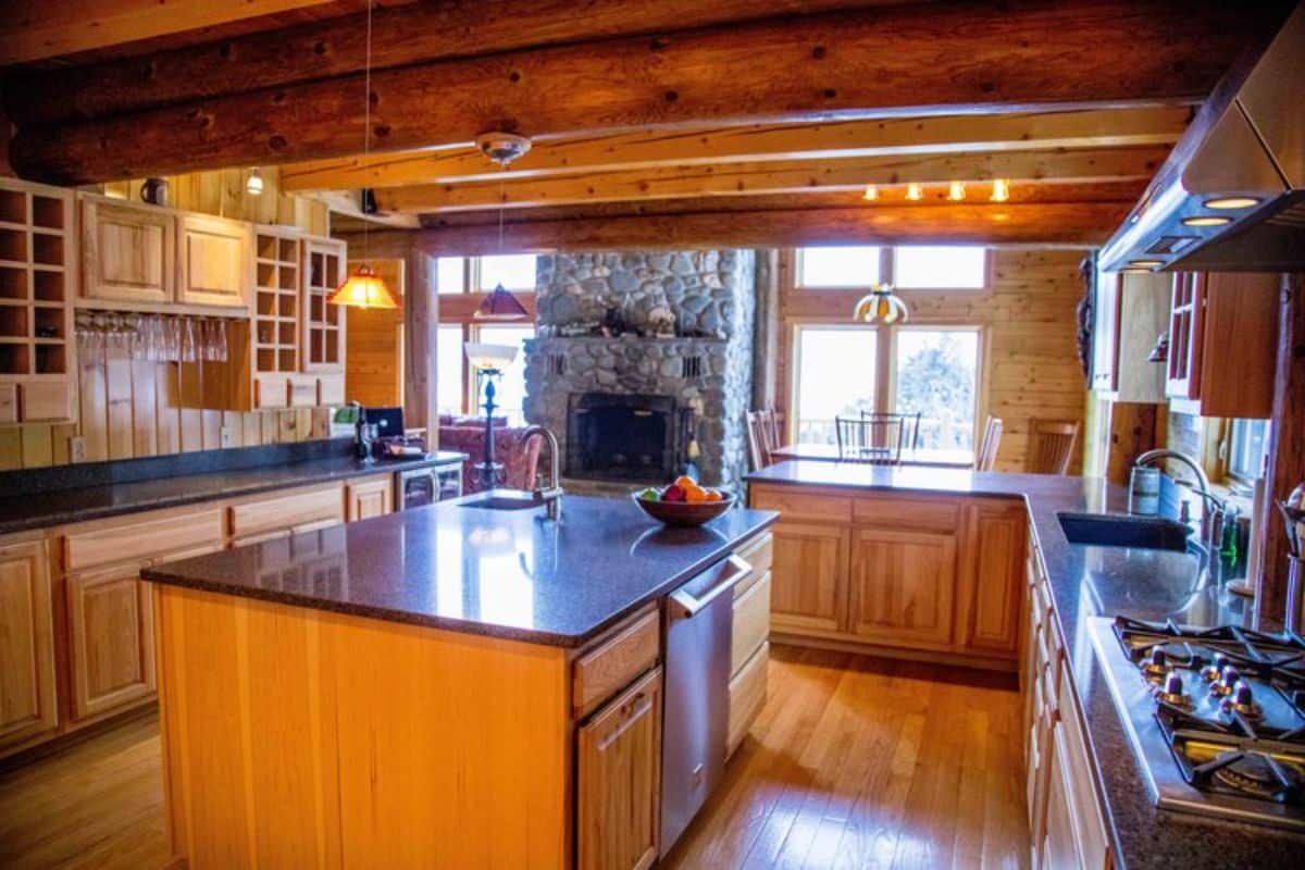 kitchen with dark wood cabinets and dark gray countertop