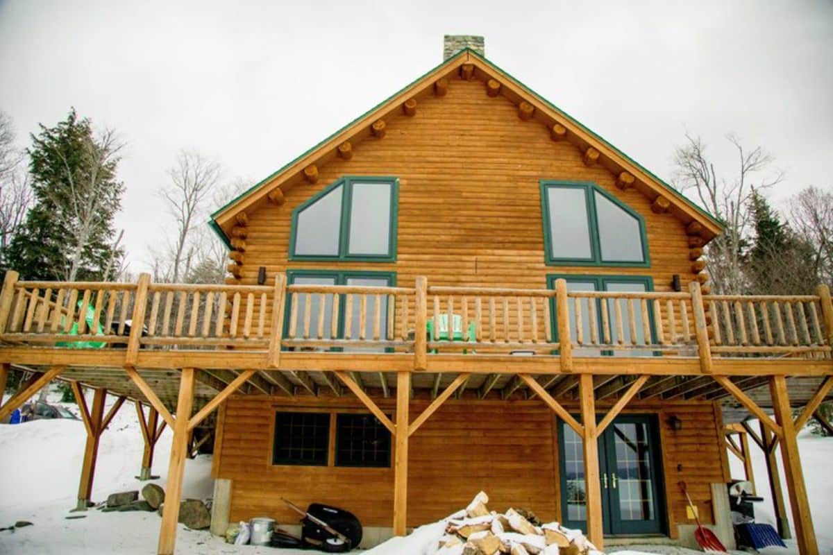 open balcony on side of cabin above walkout basement