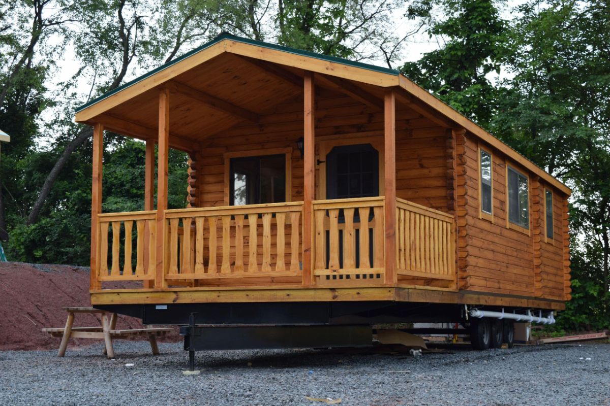 front of tiny house log cabin with porch