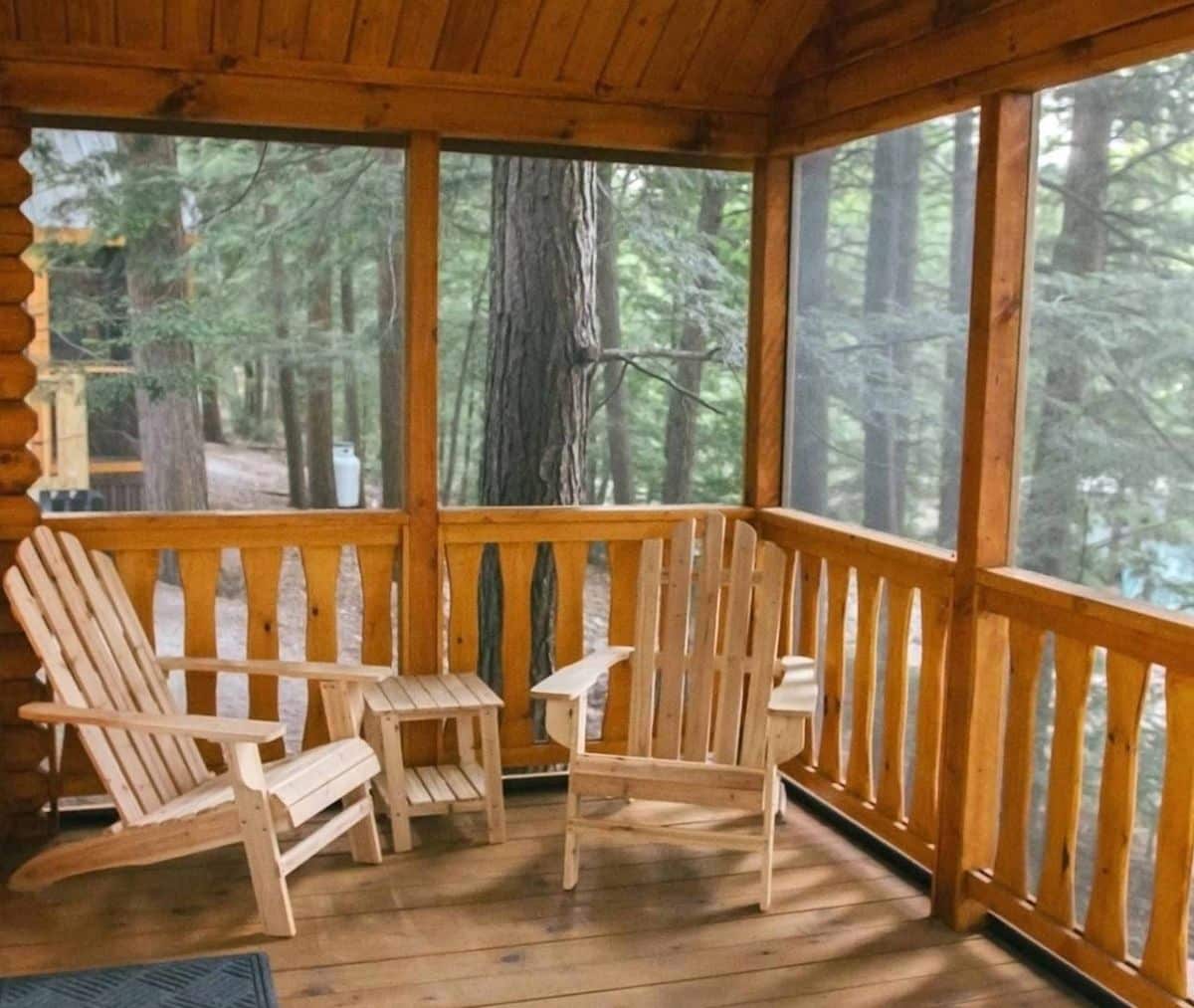 covered porch with adirondack chairs