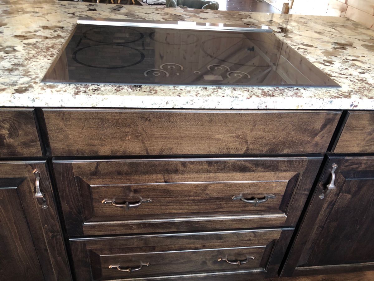 flat top stove on marbled counter