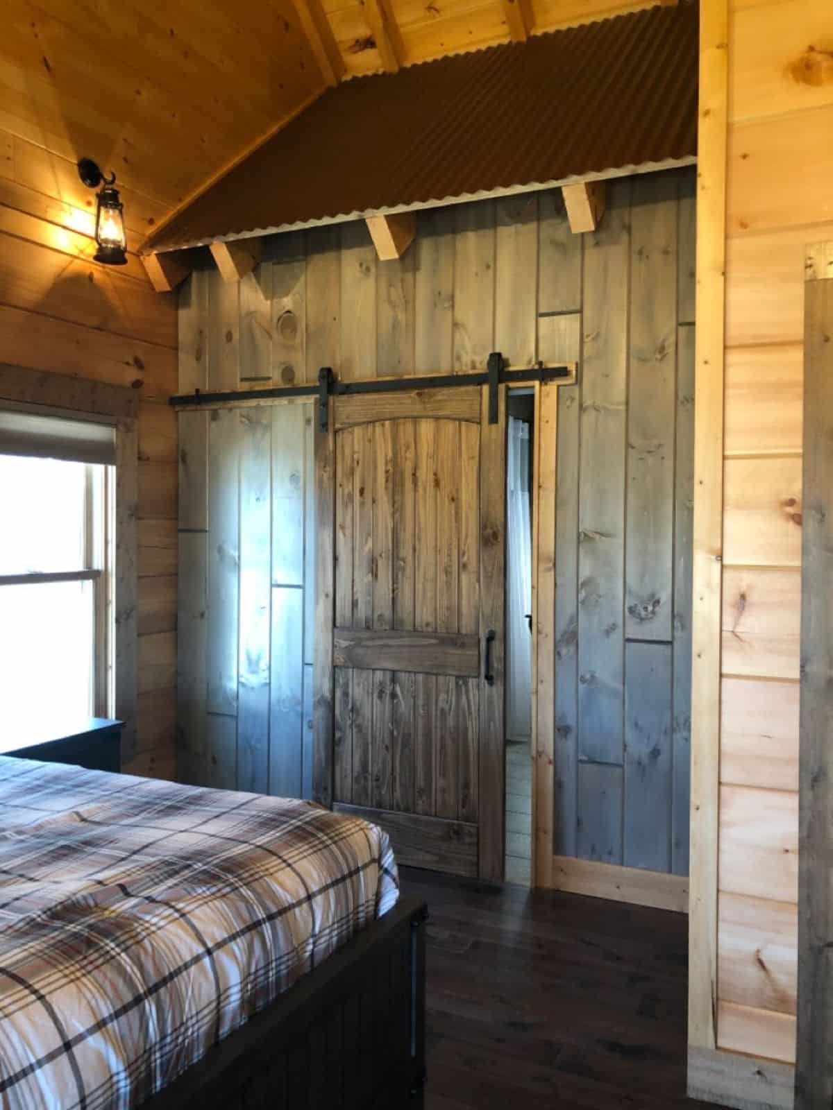 barn door closure on bathroom in cabin