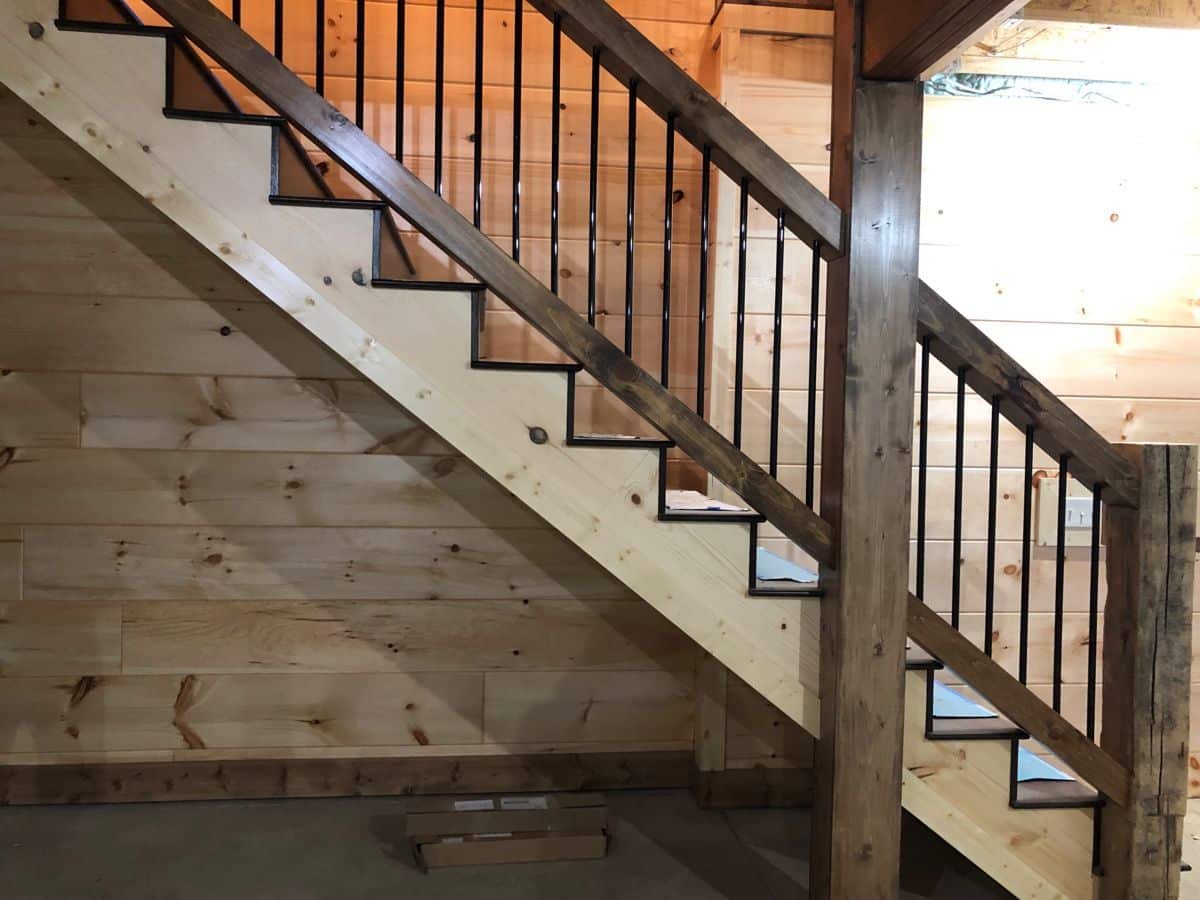 wood stairs leading to second floor of cabin