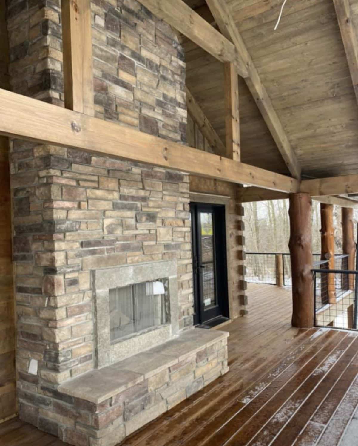 fireplace outside on deck of cabin