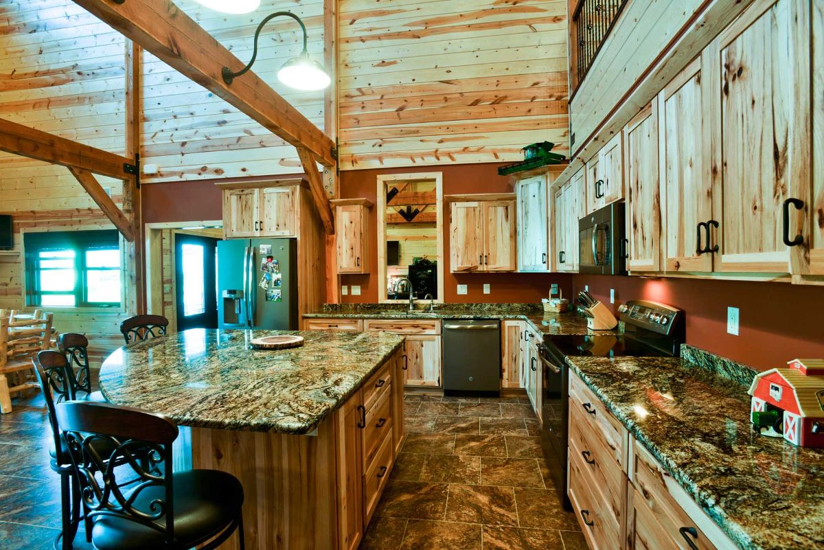 view across kitchen with cabinets on right and island on left