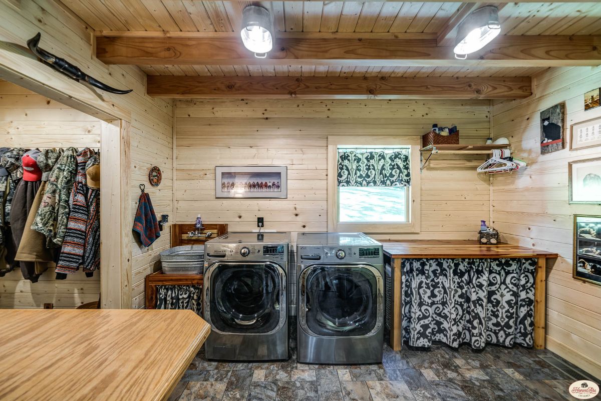 laundry room with stainless steel updated washing machine and dryer