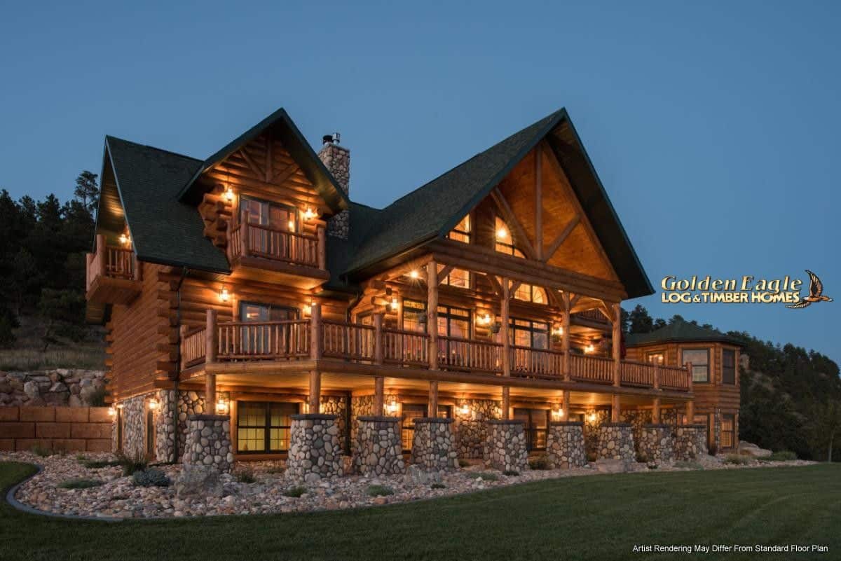 cabin lit up after dark with multiple covered porches