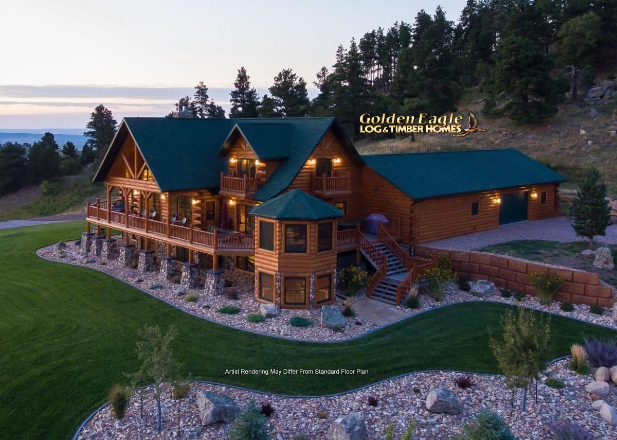 sprawling cabin with green roof and rock landscaping